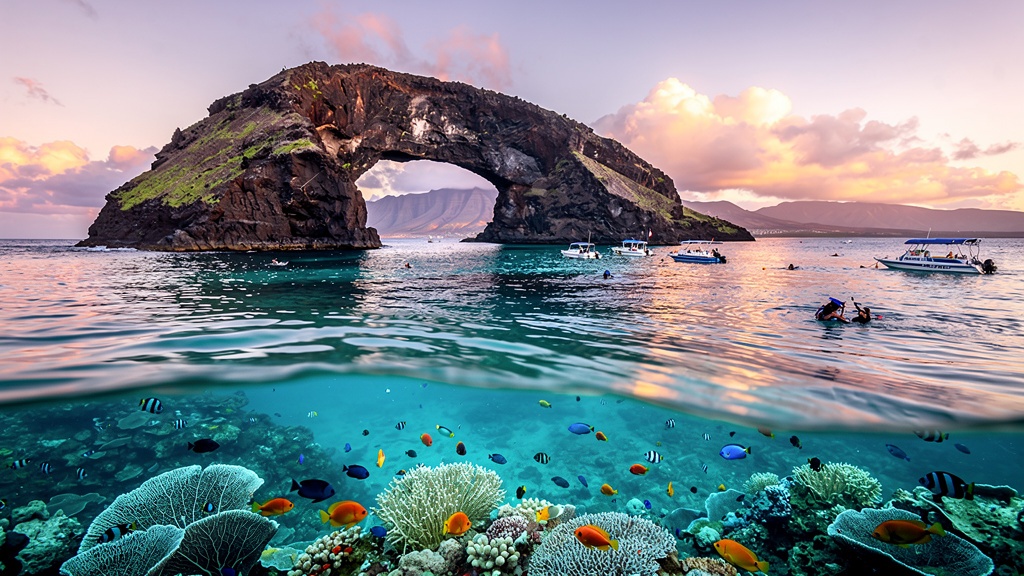 Molokini Crater rising from the turquoise ocean off Maui